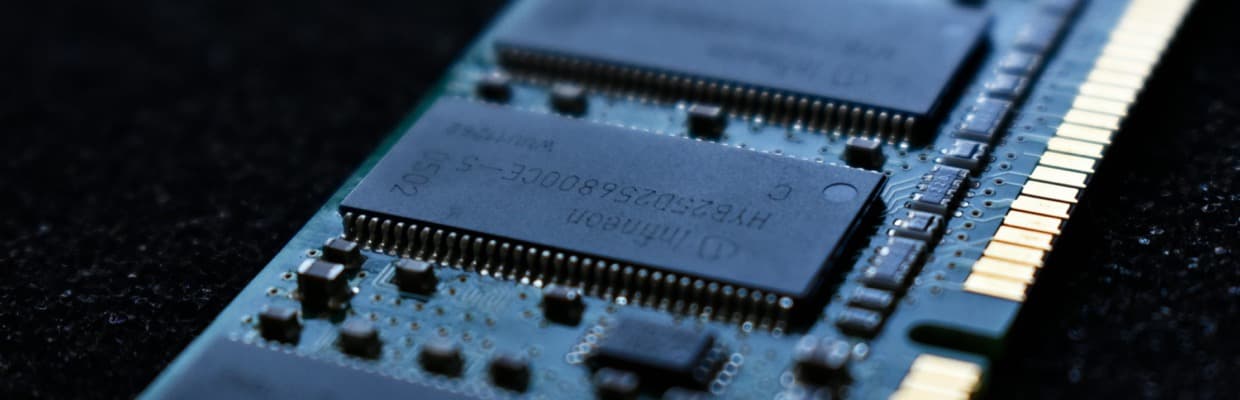 A computer memory module on a dark background.